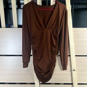 Selling this tight-fitting Blush Mark dress.